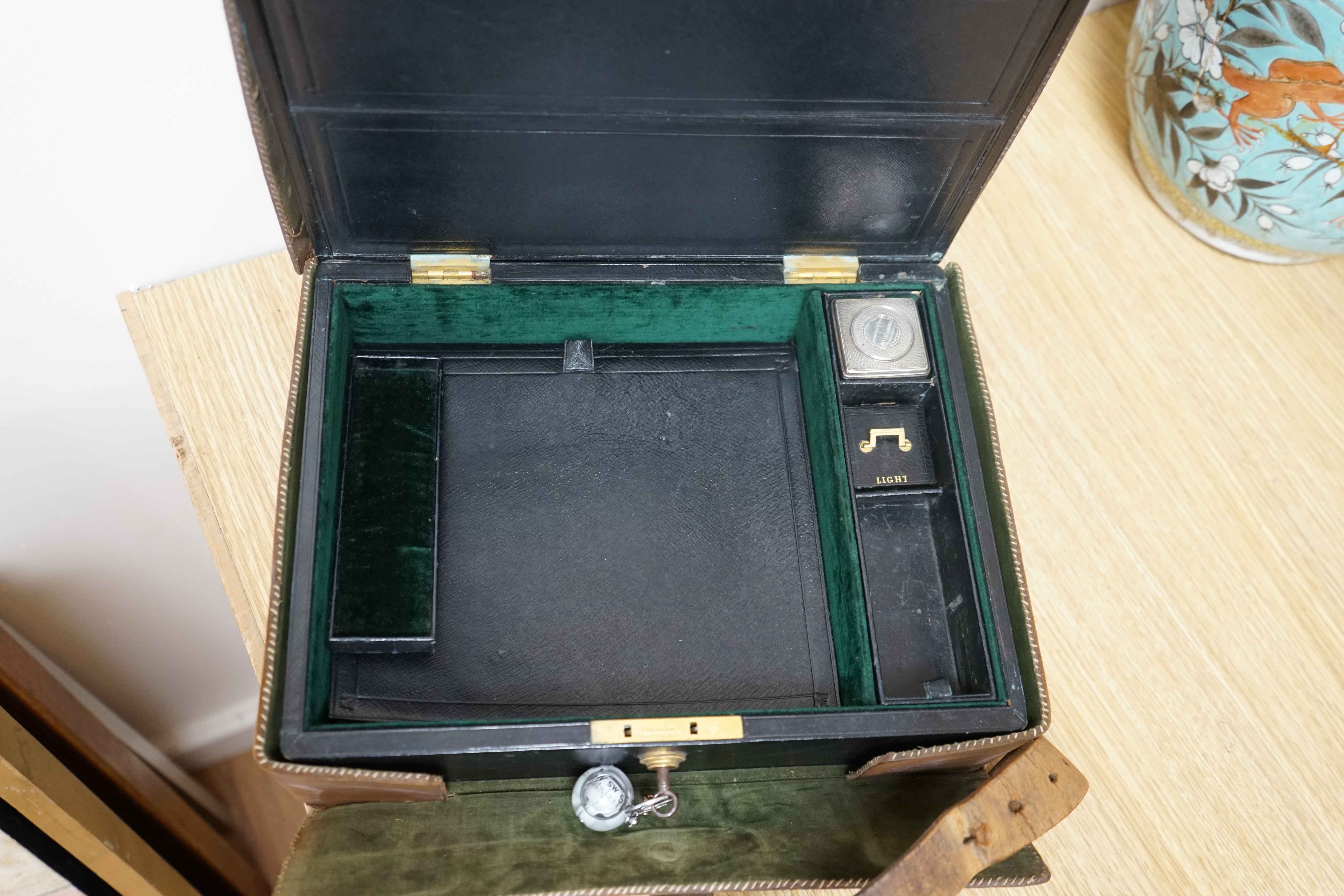 Wells & Lambert, London, a travelling writing box and outer leather case, with Bramah lock and keys, with monograms and inscriptions of Rev. George A. Robins, the box incorporating a silver lidded inkwell, 33cm wide. Con